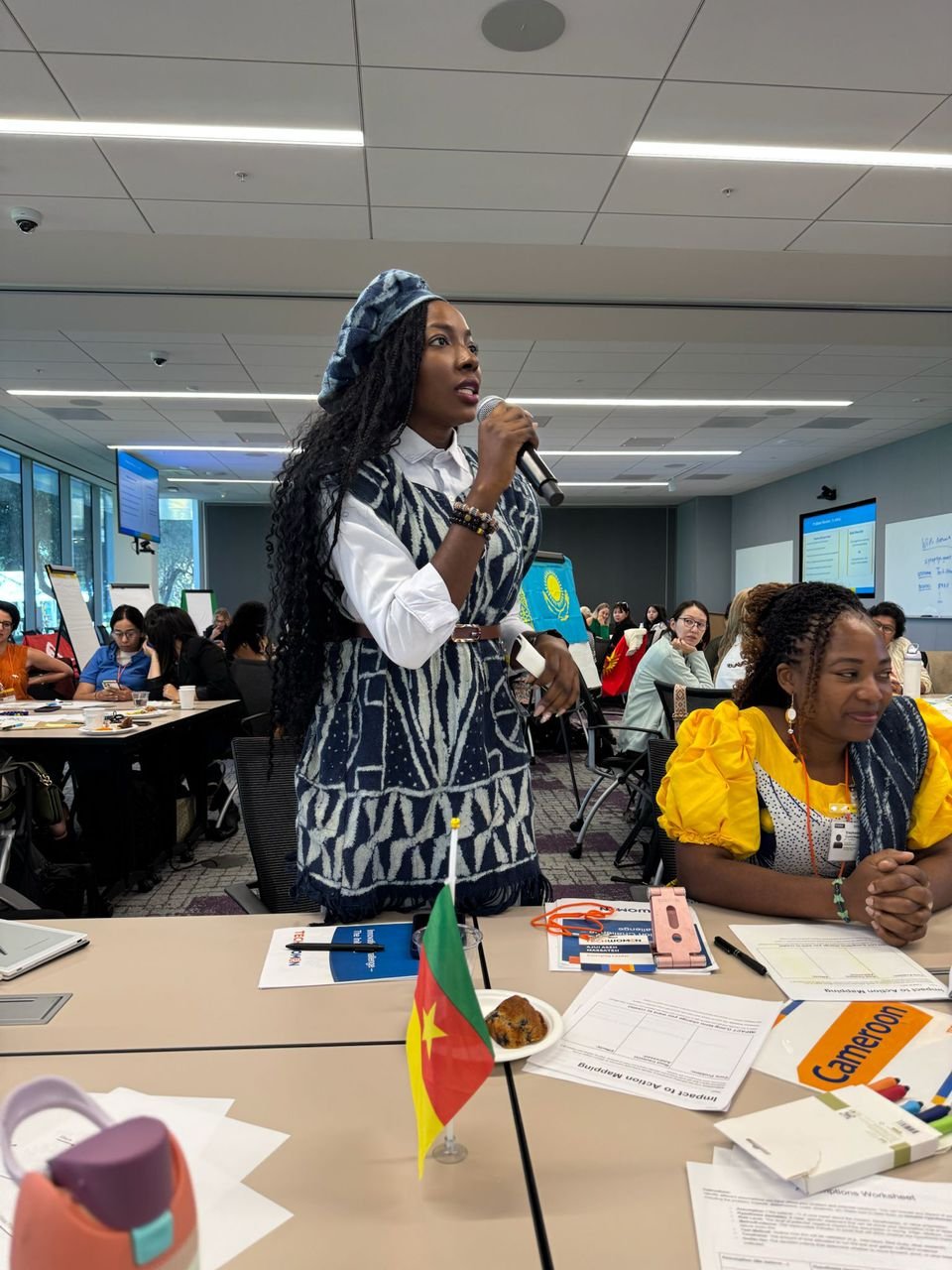 Dr. Ajui presenting at event